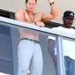 Mark Wahlberg shows off his muscles whilst waving to fans