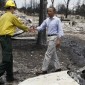 President Barack Obama looks over fire damaged homes in the Mountain Shadow